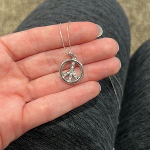 Sterling silver peace necklace.